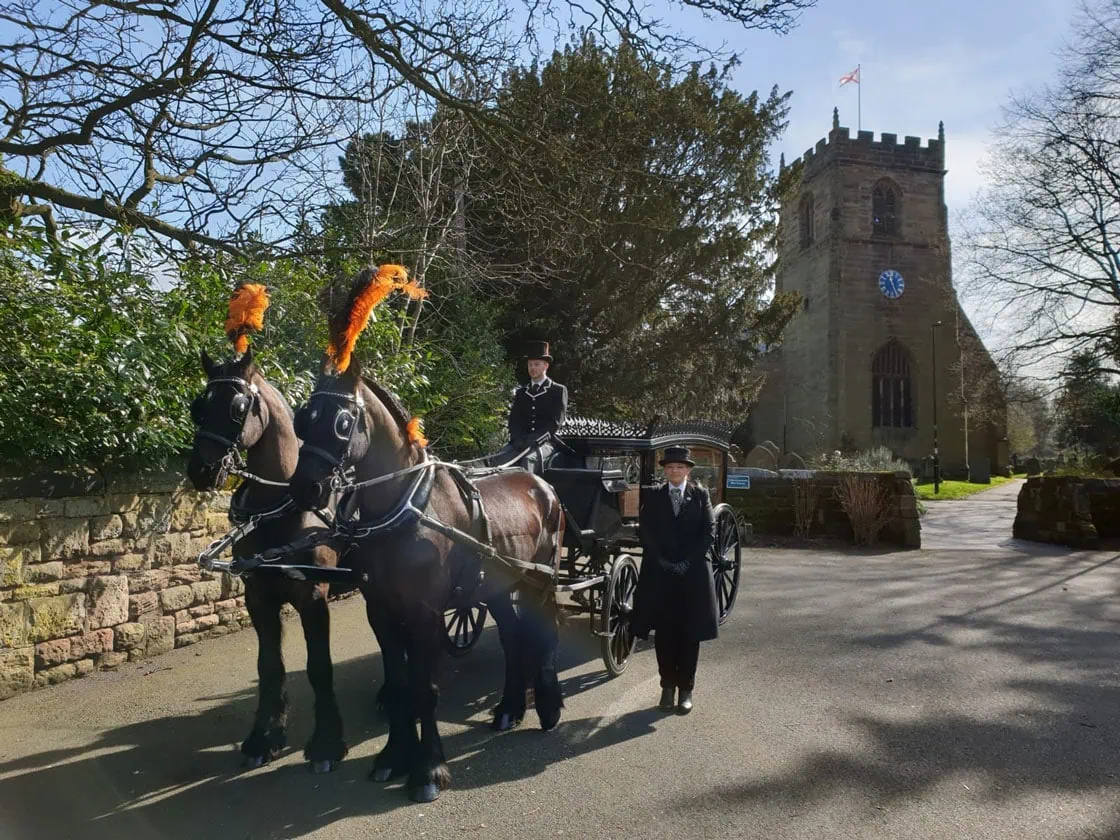 black horse drawn hearse as supplied by Sincerity Funerals Funeral Directors Wolverhampton