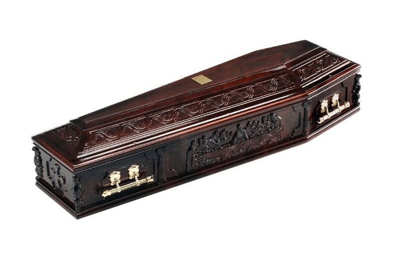 Solid wood coffin depicting The Last Supper on the side panels and ornate carvings to the raised lid.